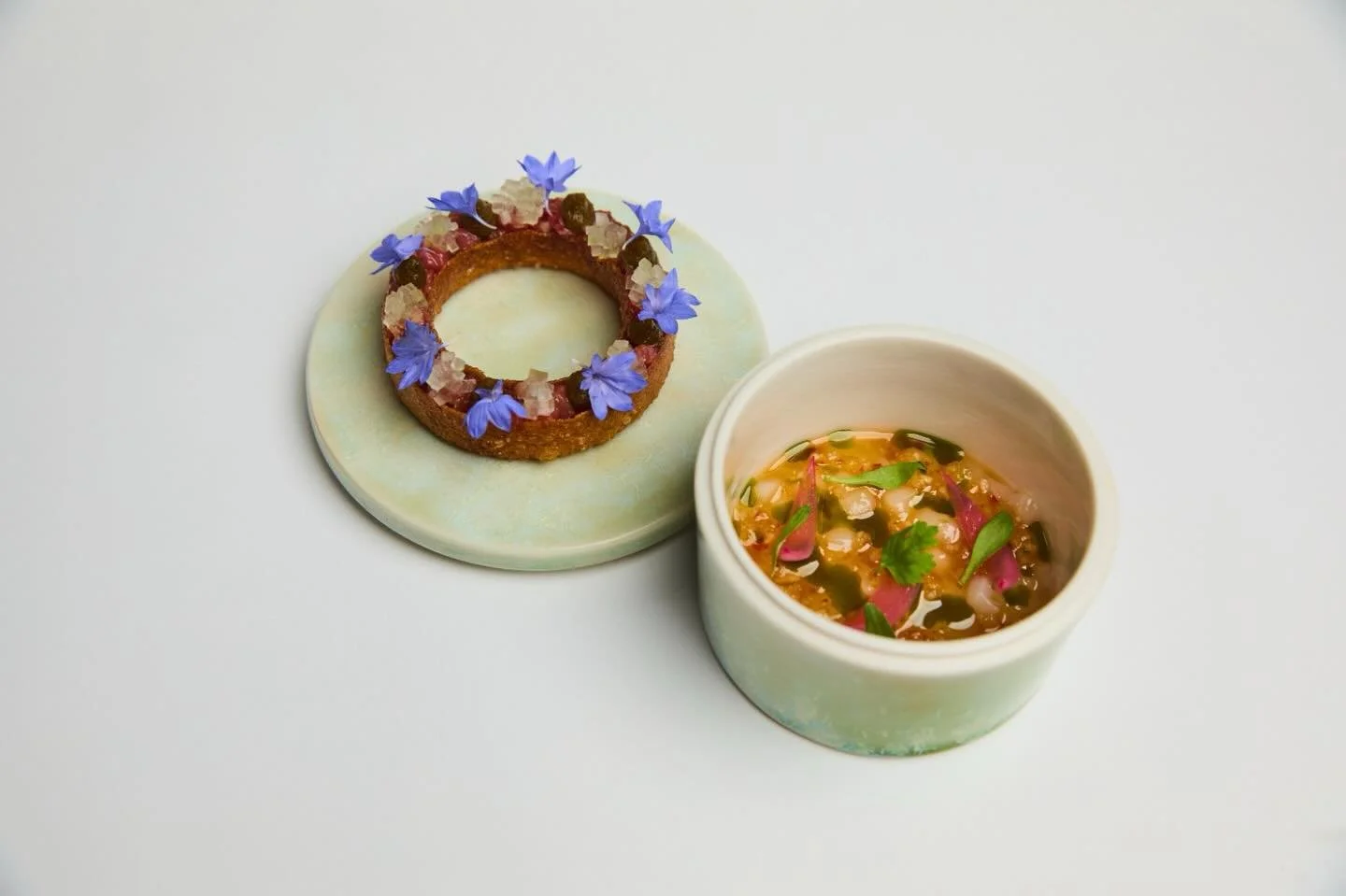 Land &amp; Sea is our interpretation of surf and turf served as a cold starter.

Hokkaido scallop ceviche dressed in nuoc cham.
A5 wagyu tartare seasoned with smoked shoyu and finished with jalape&ntilde;o kosho.

Two distinct expressions meeting on 