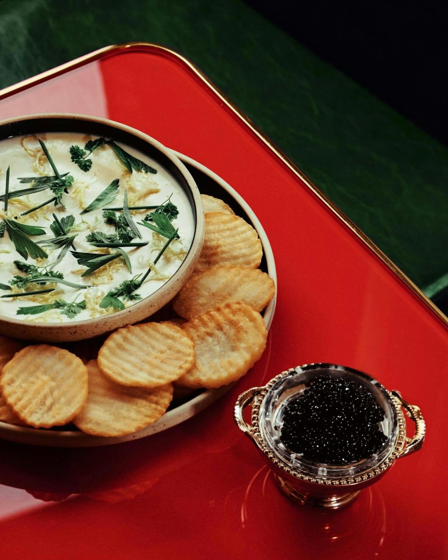 Because indulgence starts with a crisp: Golden cottage fries dressed in fines herbes and ranch, finished with Petrossian Ossetra caviar.