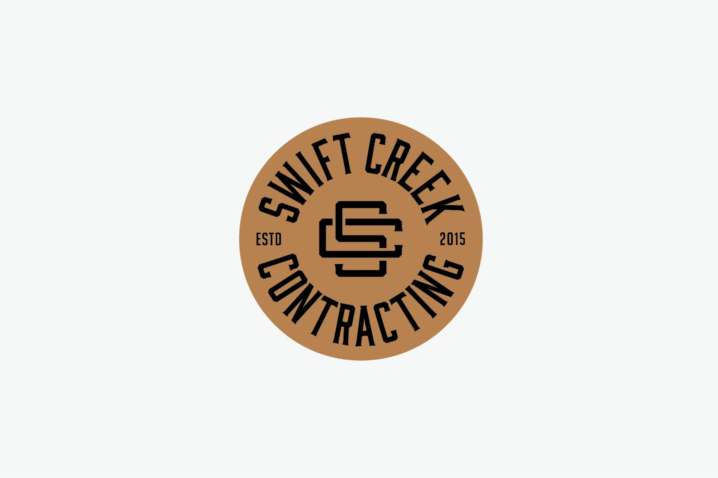 A logo for Swift Creek Contracting in a circular design with brown background, black text, and stylized letters SC in the center.