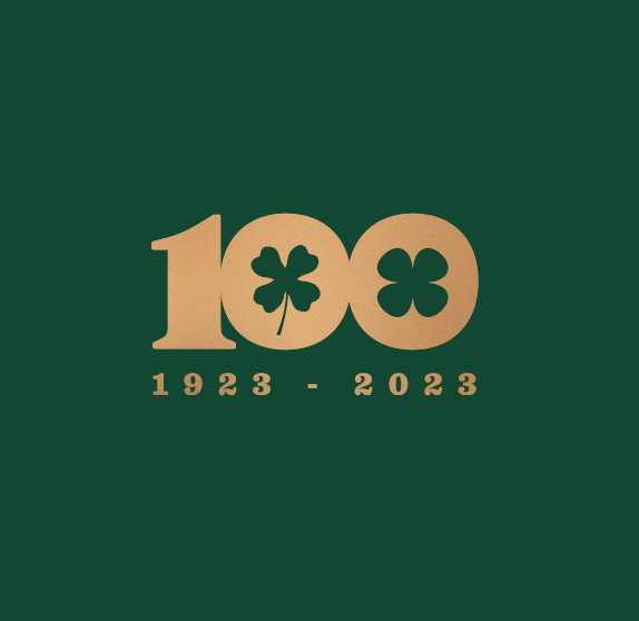 Metallic gold number '100' on a dark green background, celebrating a 100th anniversary from 1923 to 2023.