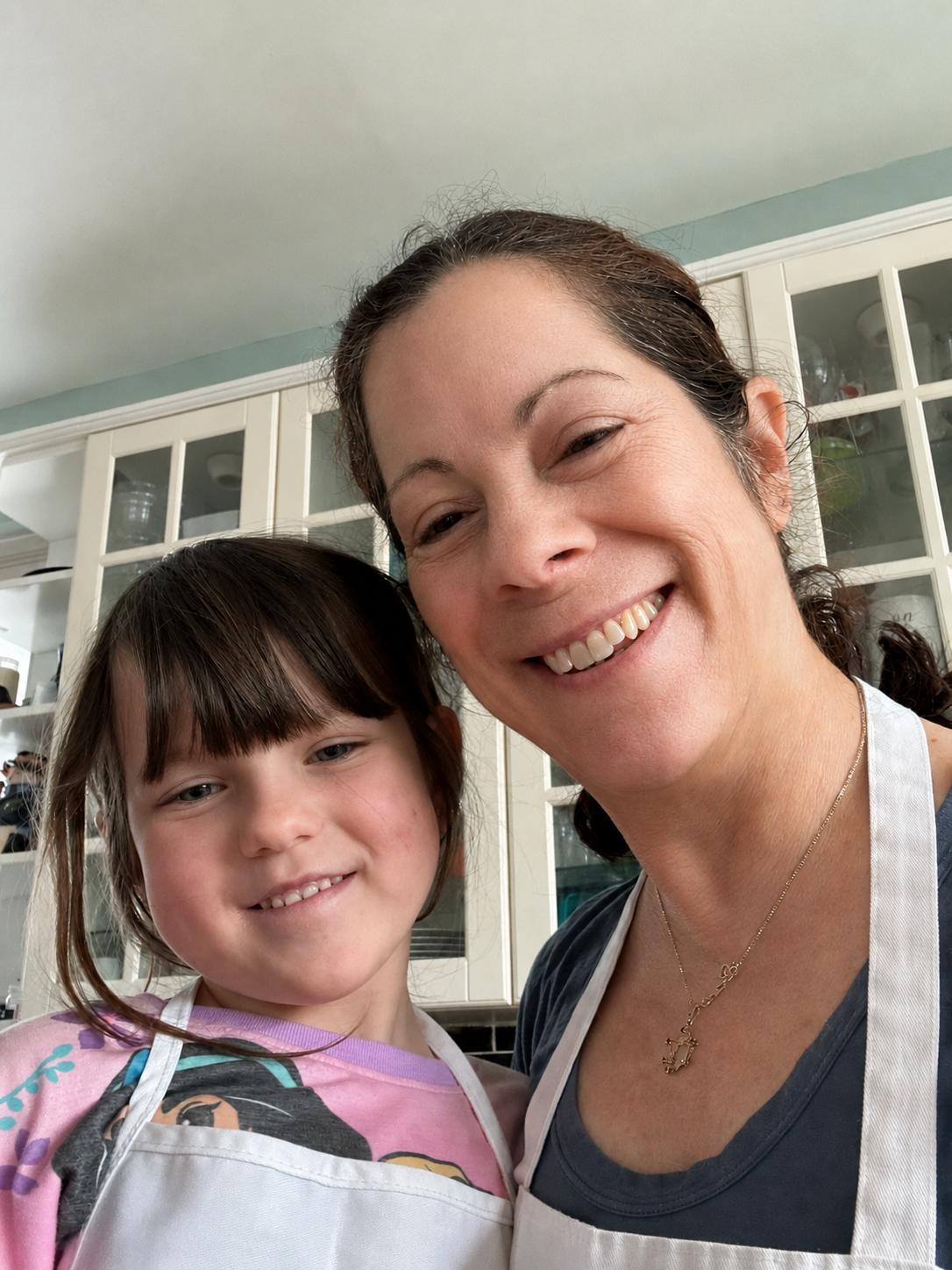 Linda Perry PMHNP-BC CNM smiling with her young granddaughter, integrative psychiatry and reproductive mental health specialist in New Jersey