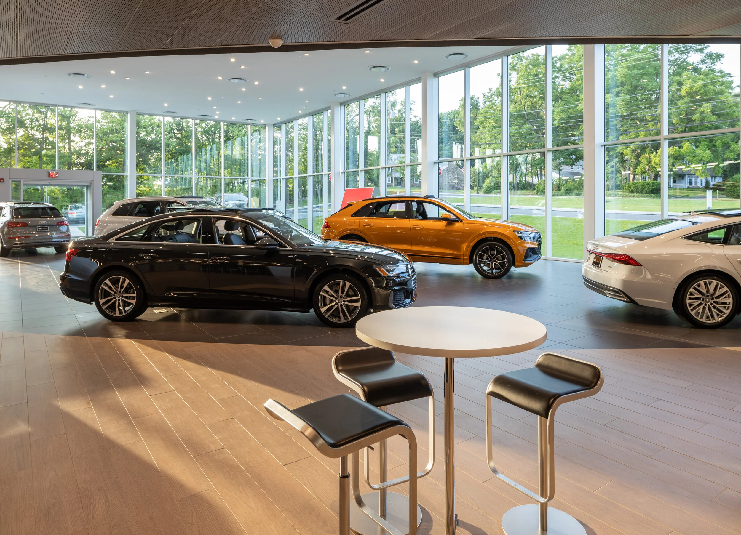 Sip some coffee at this showroom café table as you contemplate your next set of wheels.