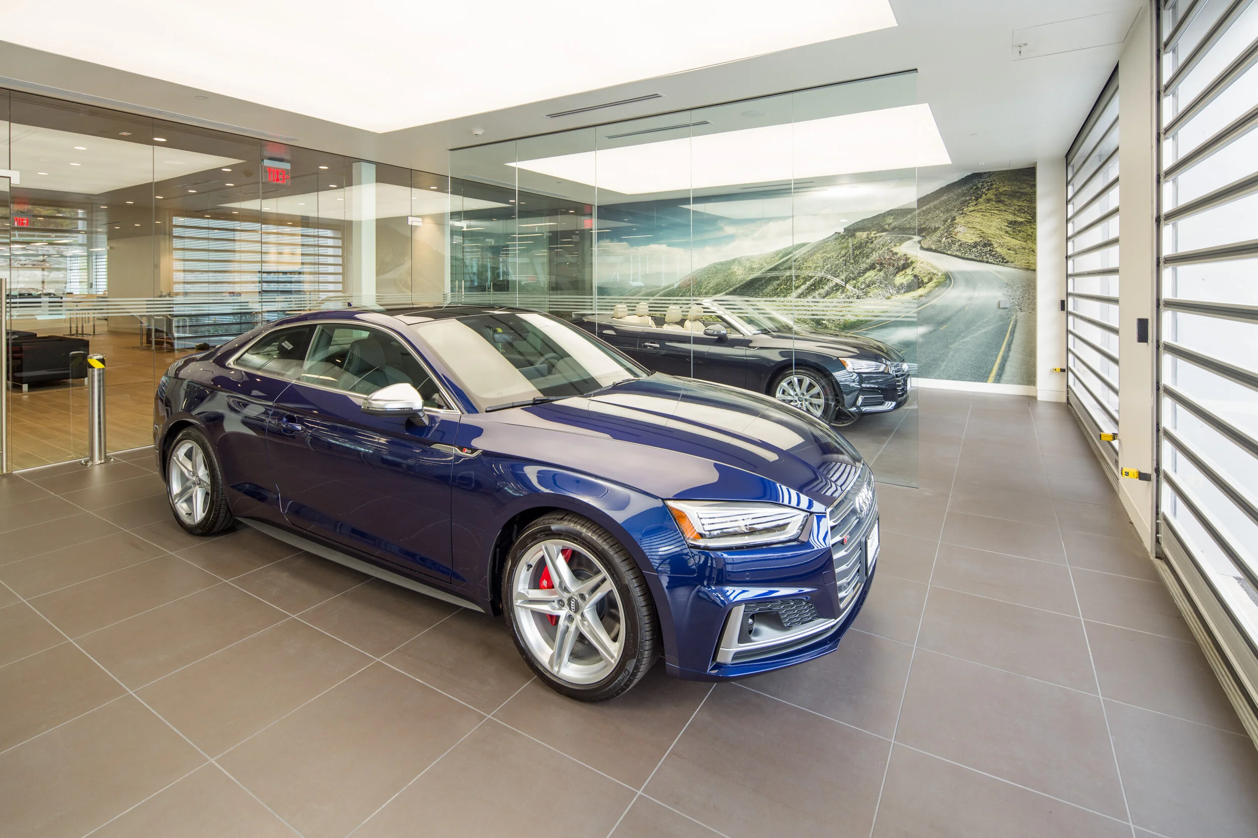 These Audis await pickup by their new owners in a custom delivery room.