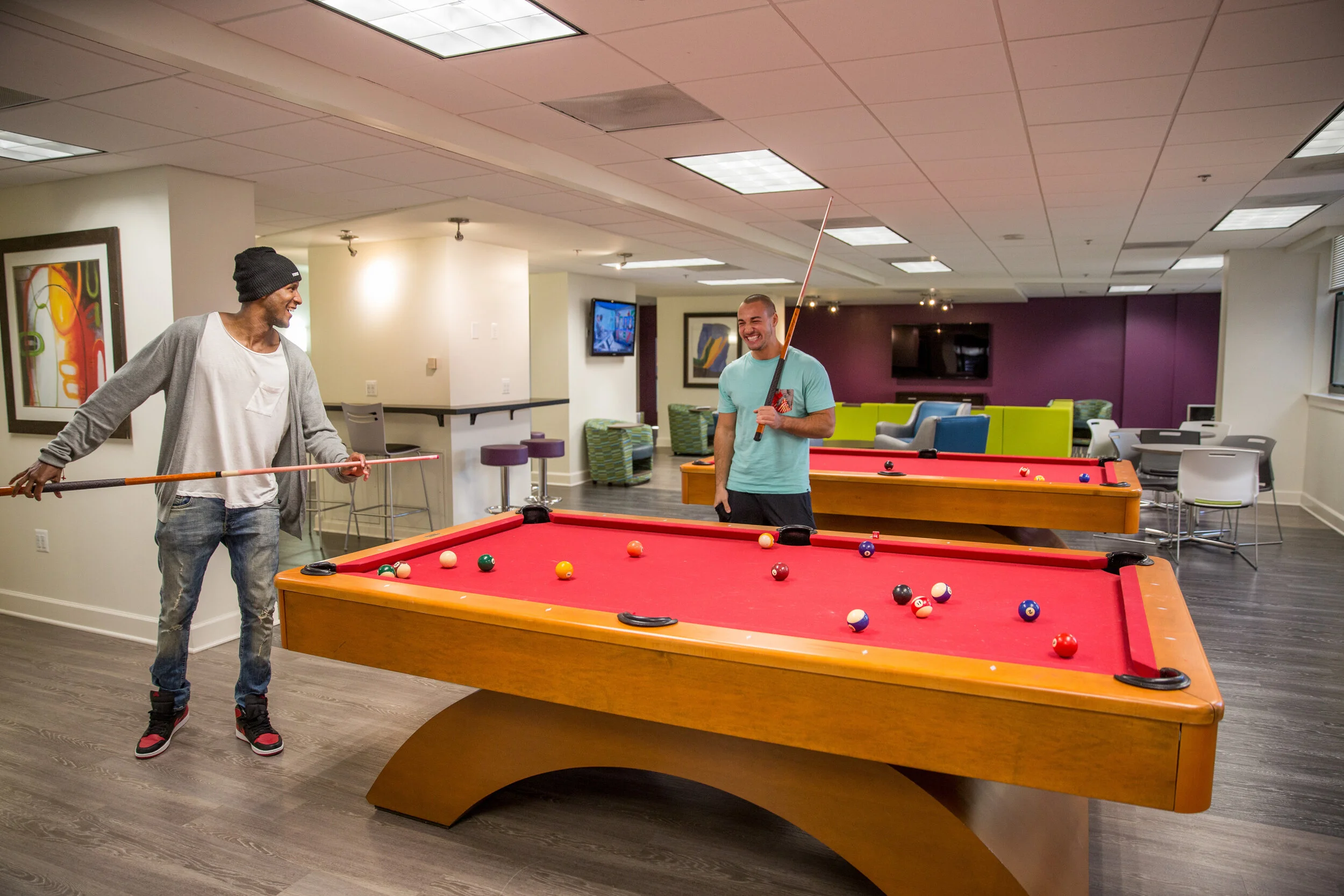 Students at the University of Maryland discuss philosophy while lining up their shots.