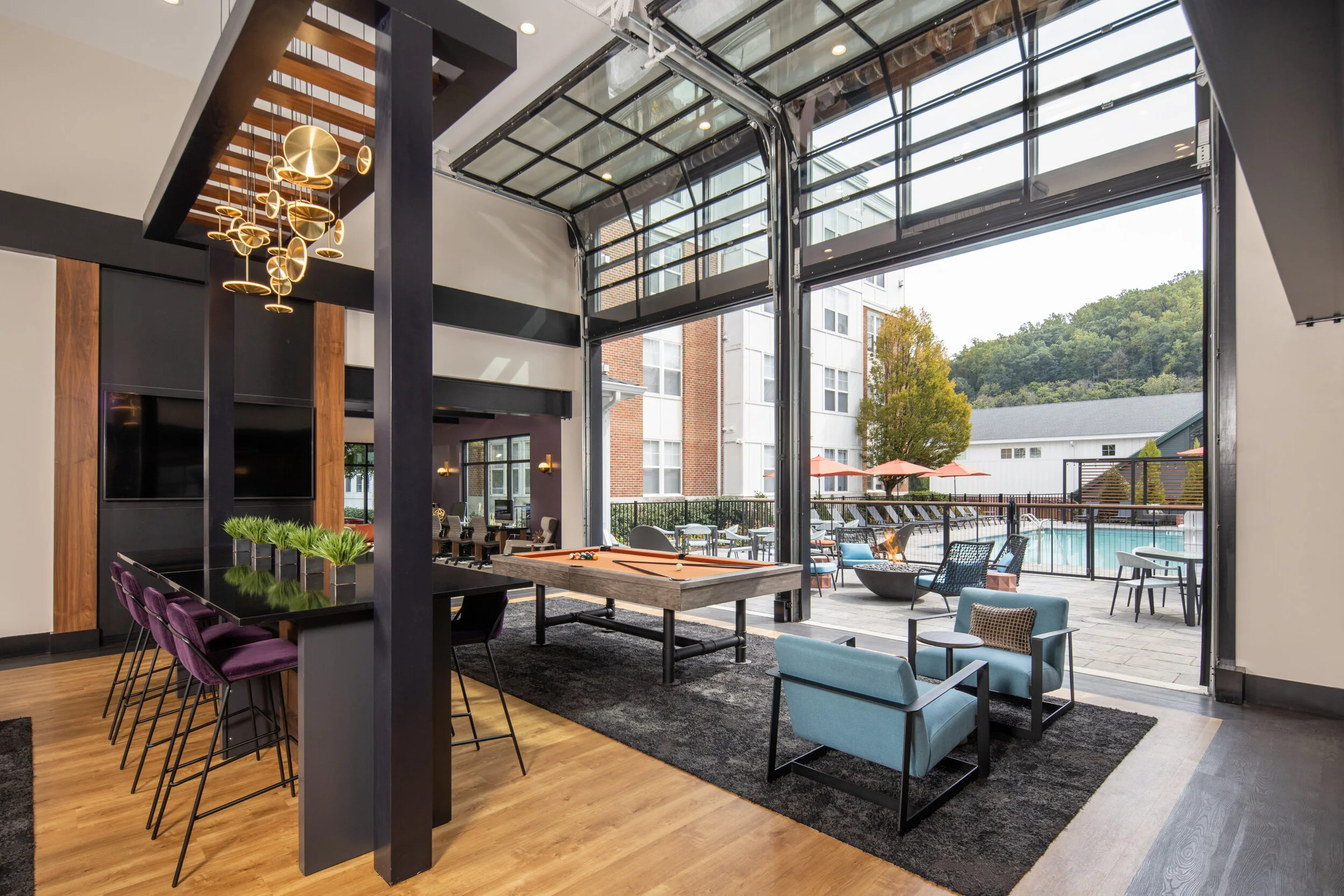 Indoor or outdoor—why not both? Garage doors make spaces flexible.