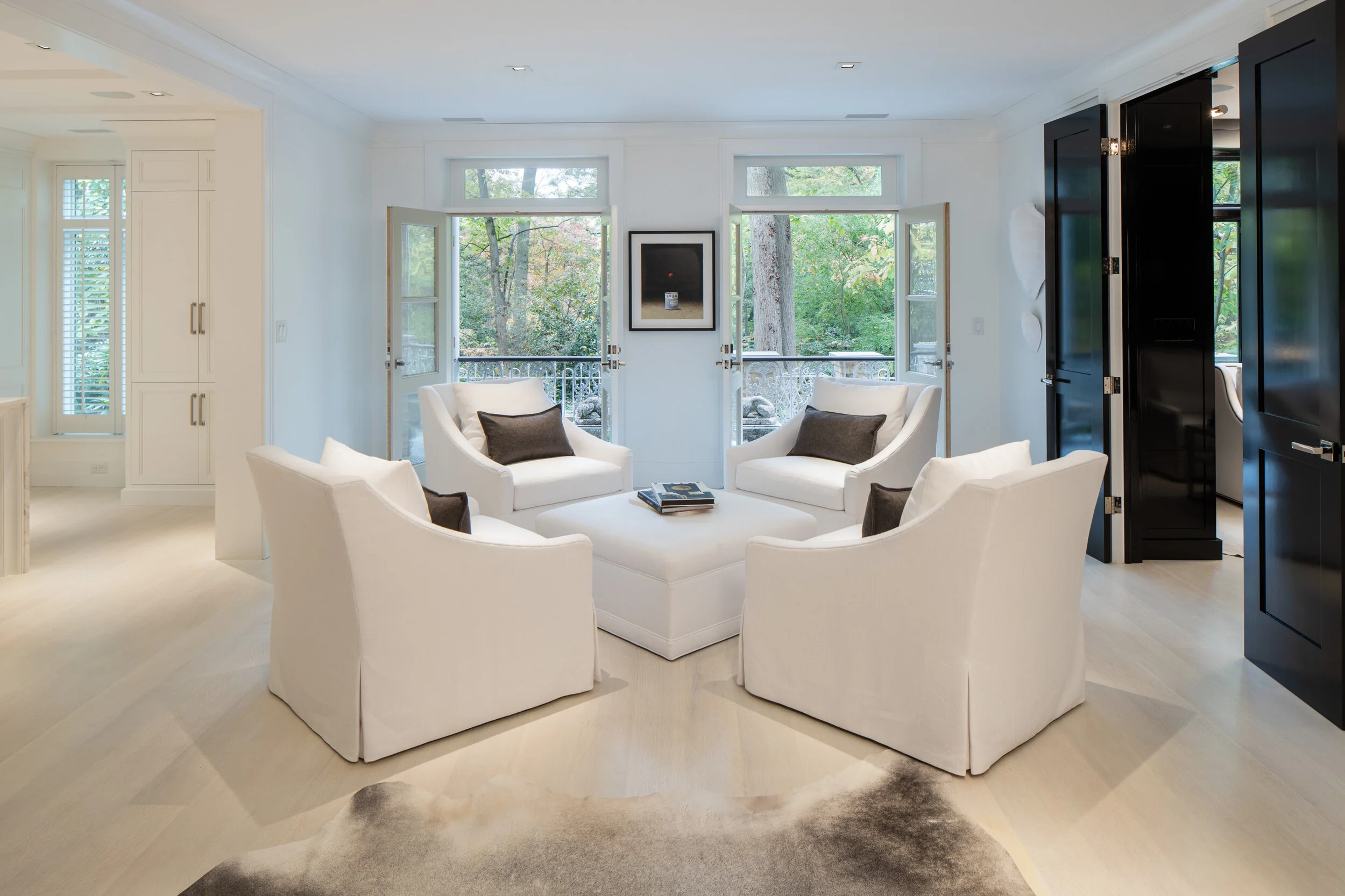 The formal living room frames a view to the great outdoors.