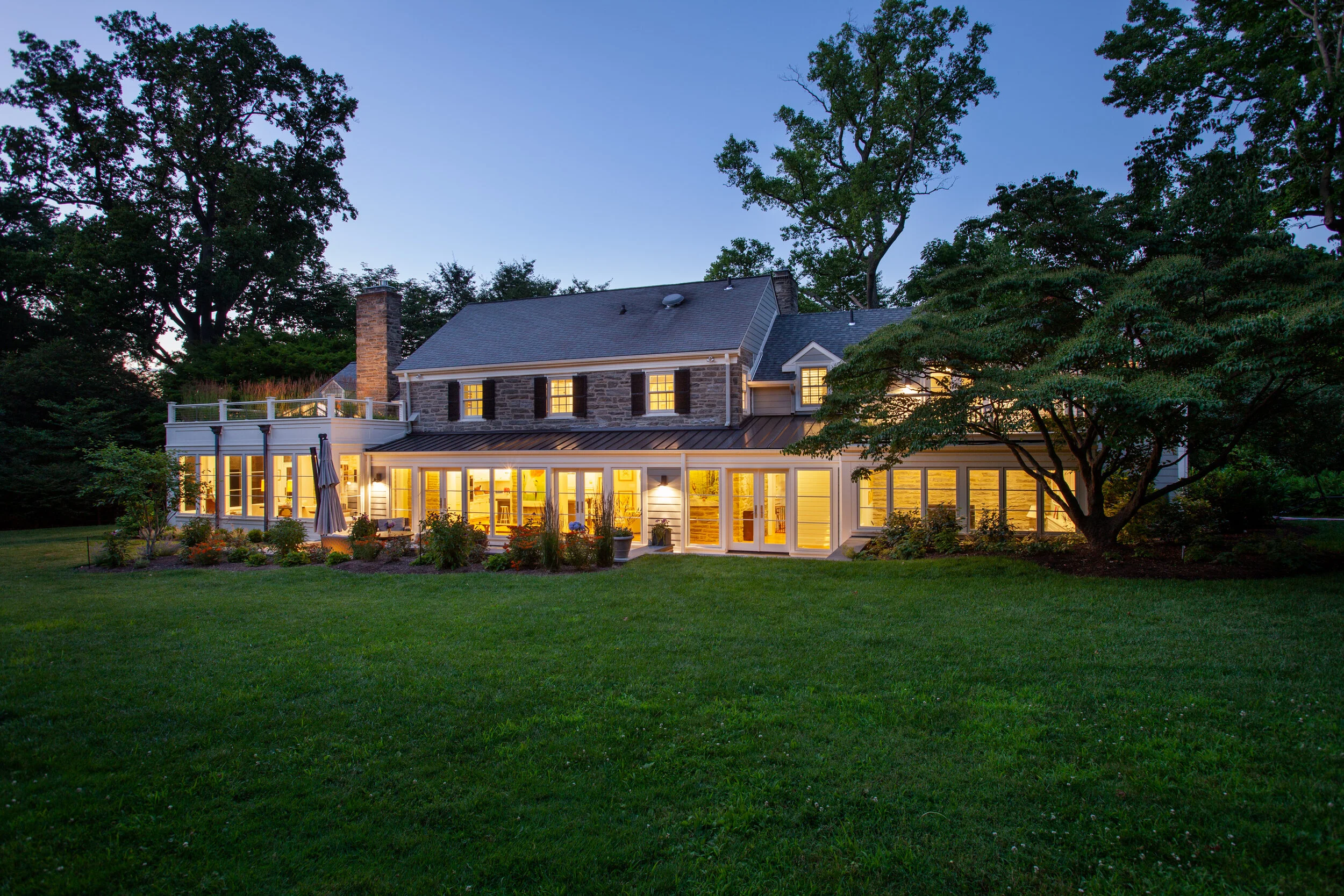 Twilight animates a private residence in the Philadelphia suburbs, as profiled in A Home and Its Range.