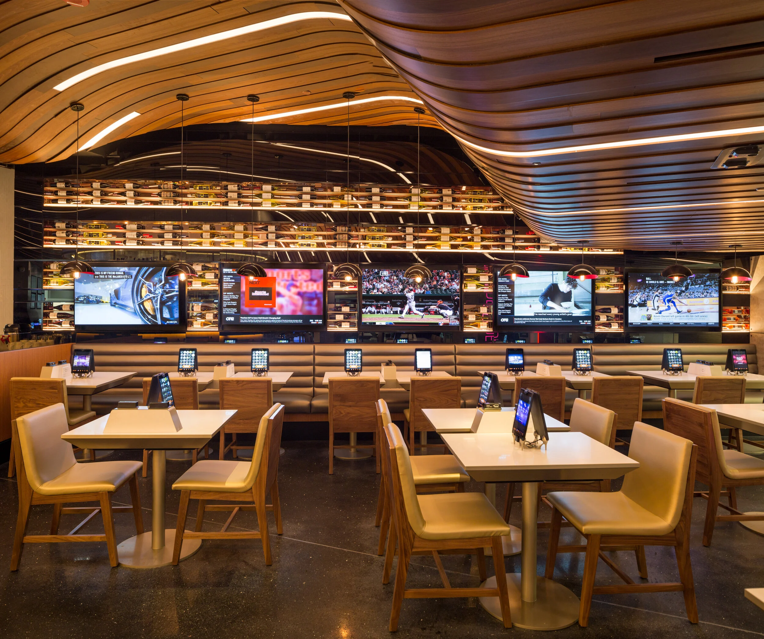 Curves – undulating curves – add drama and movement to an airport restaurant ceiling.