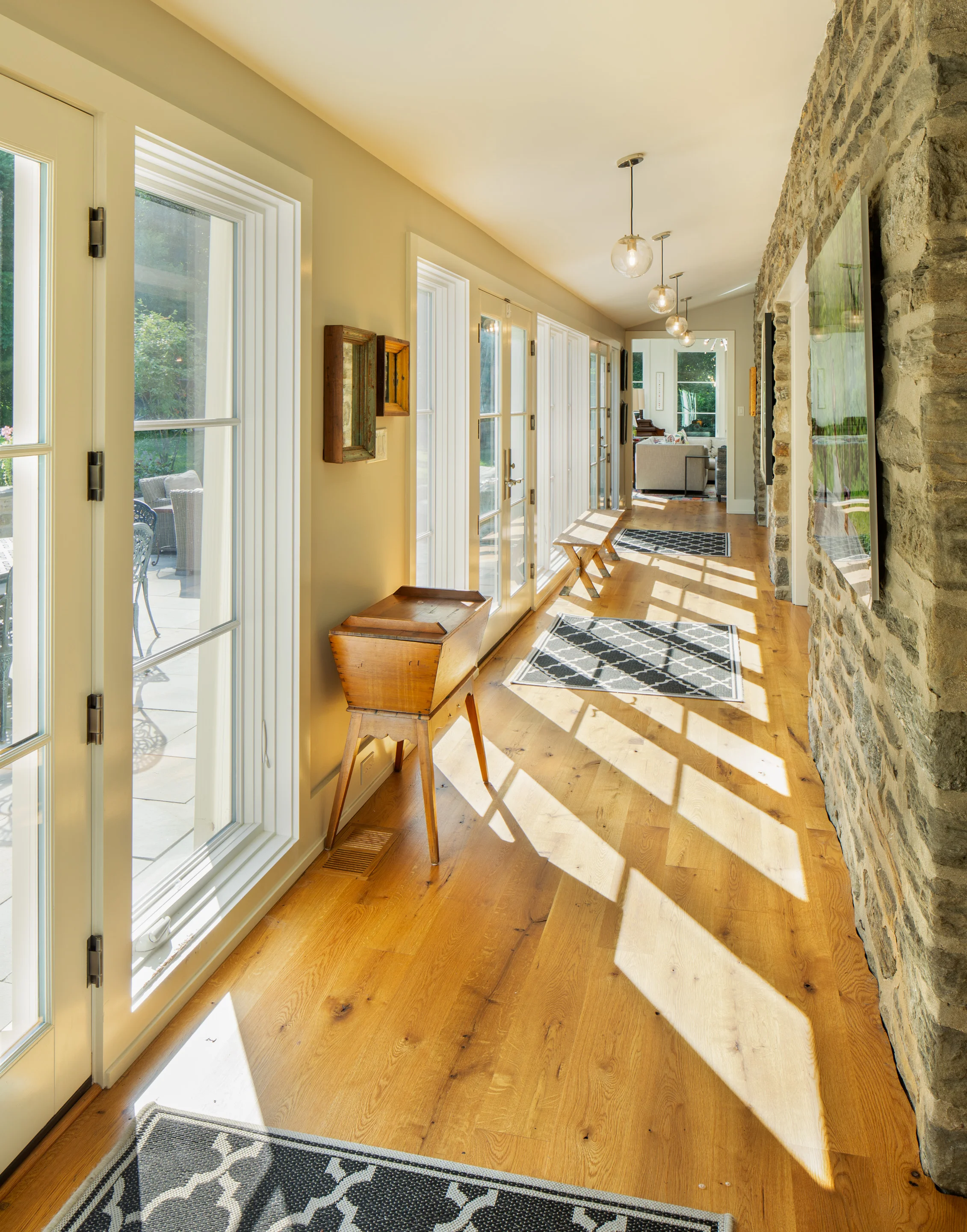 Corridor connects all of first floor rooms and brings in the light.