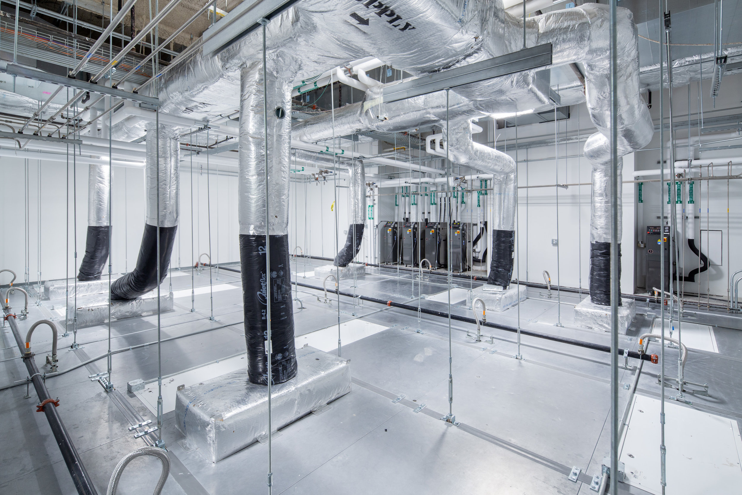 Above the ceiling sits an entire universe of mechanical systems and ducts.