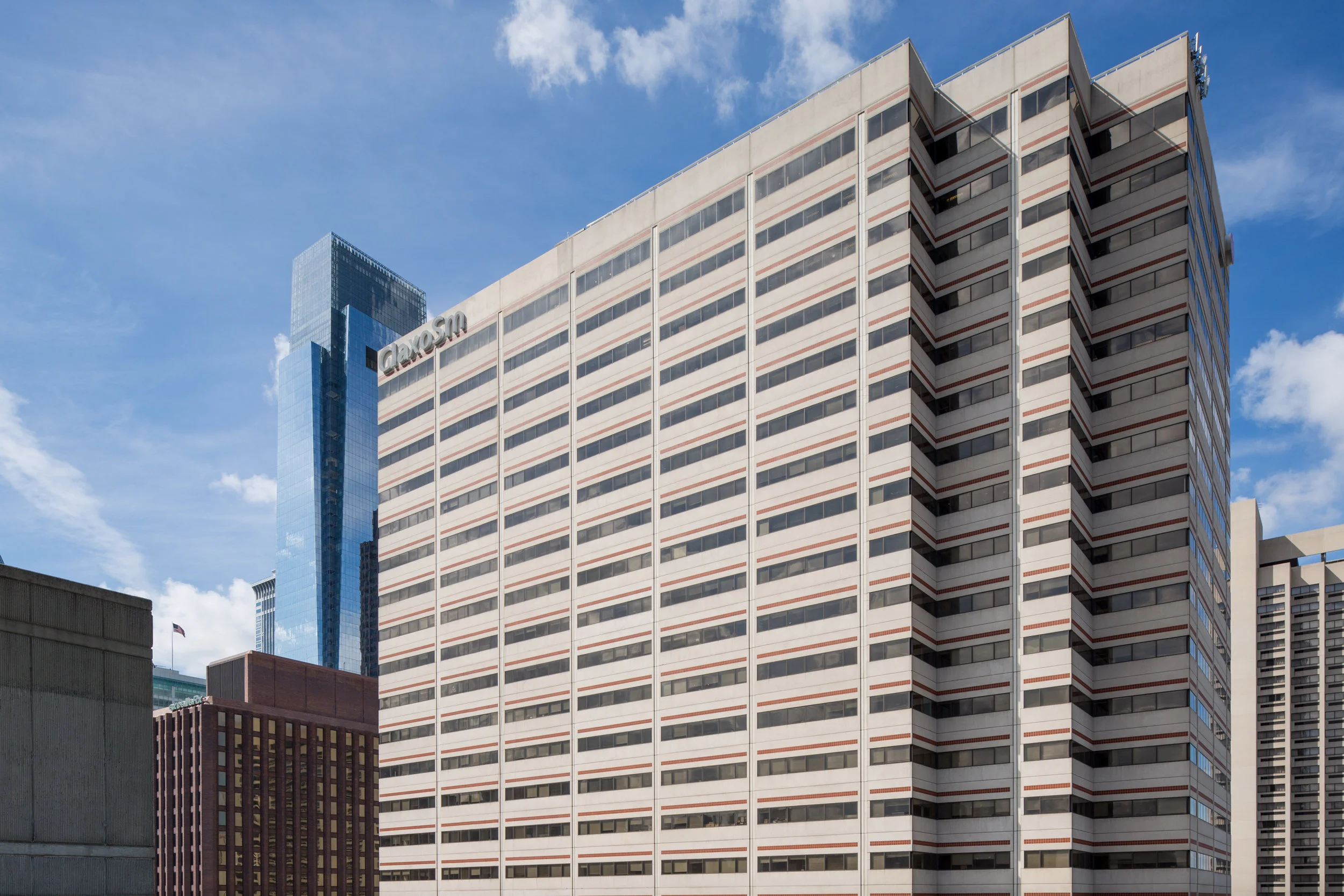 Stucco and strip windows with a ‘80s vibe.