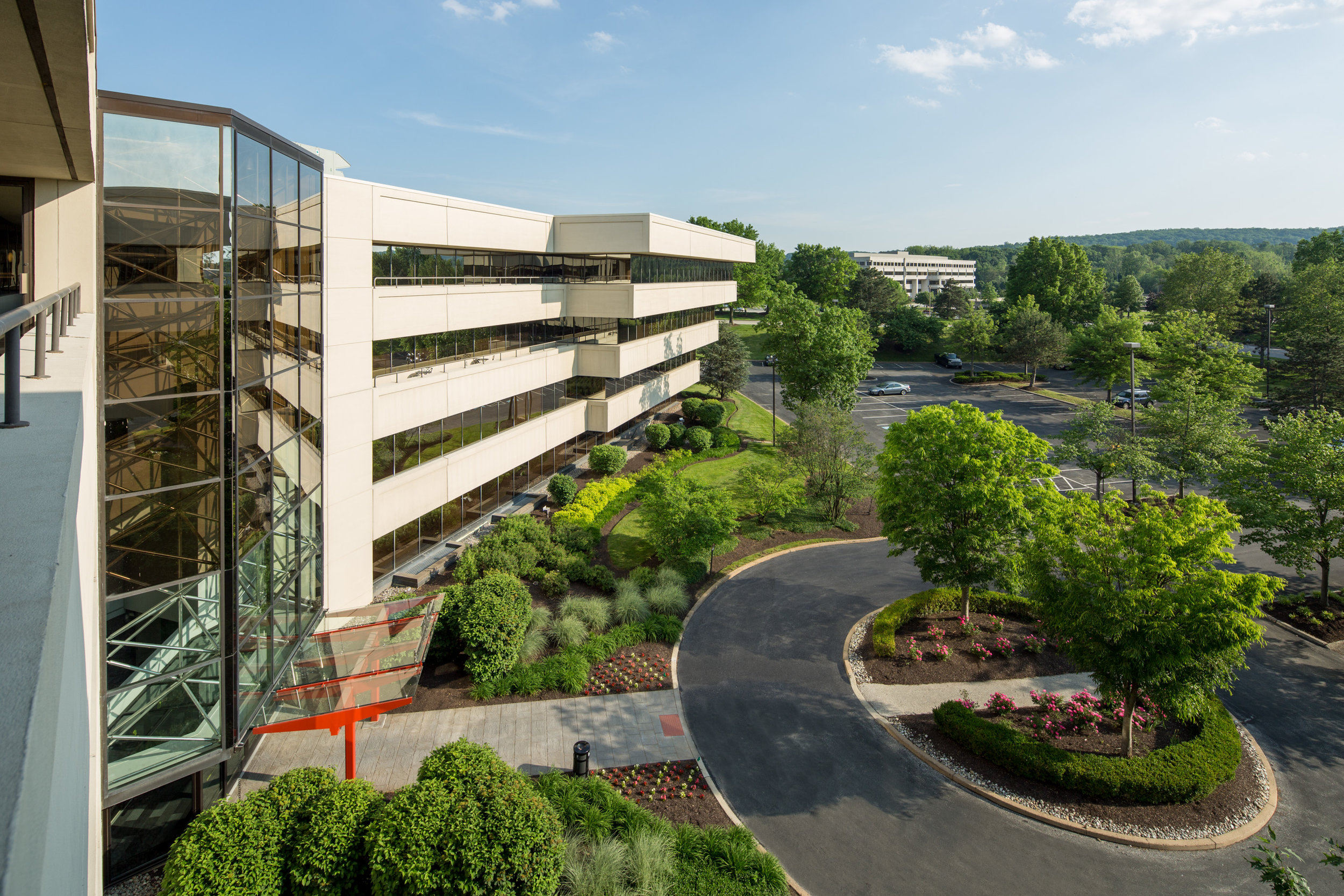 Triad, a revitalized suburban office building in a park-like setting.