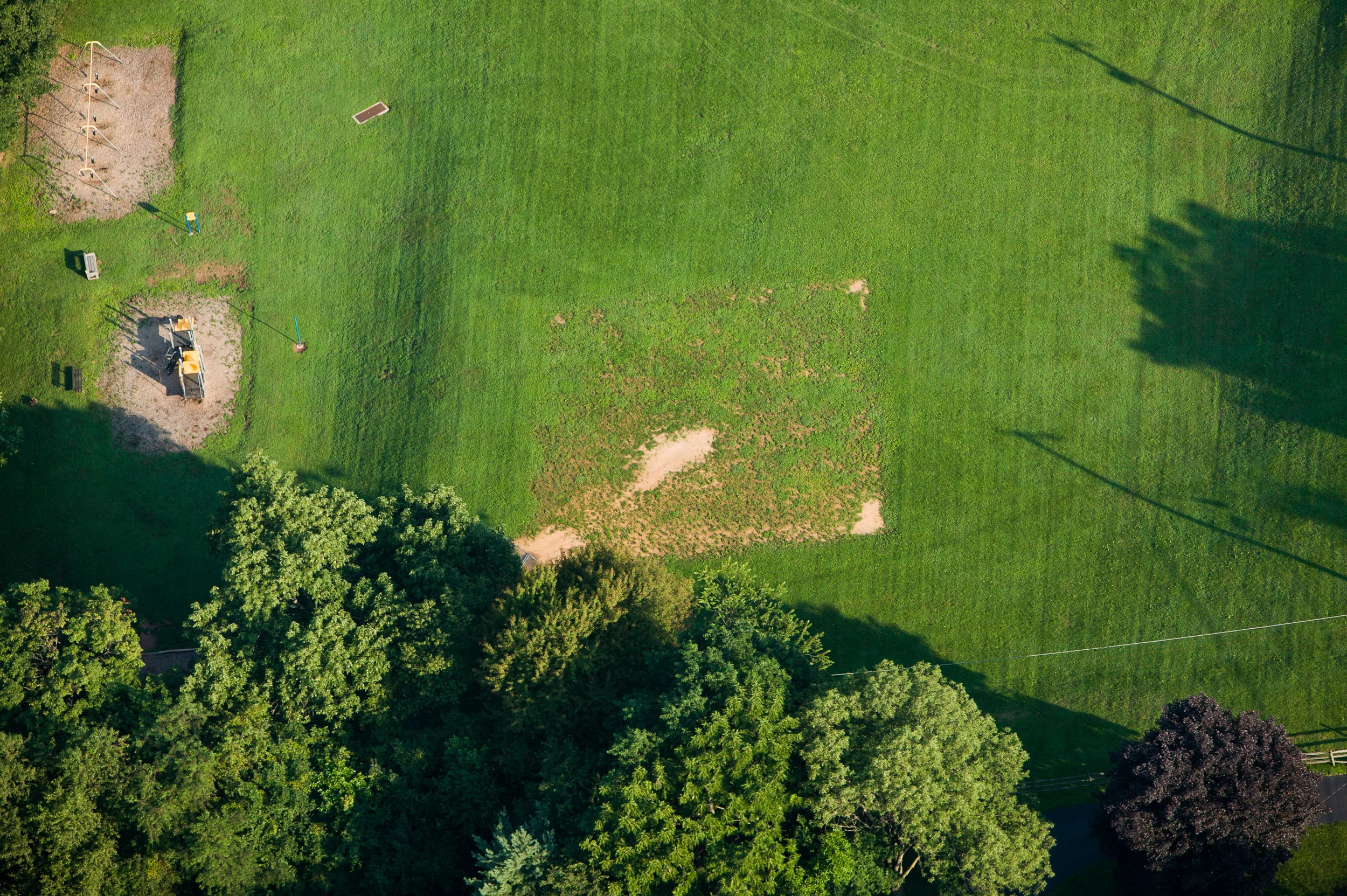 This field is faintly visible like a ghost. Notice how there is less wear as you go from home to third base.