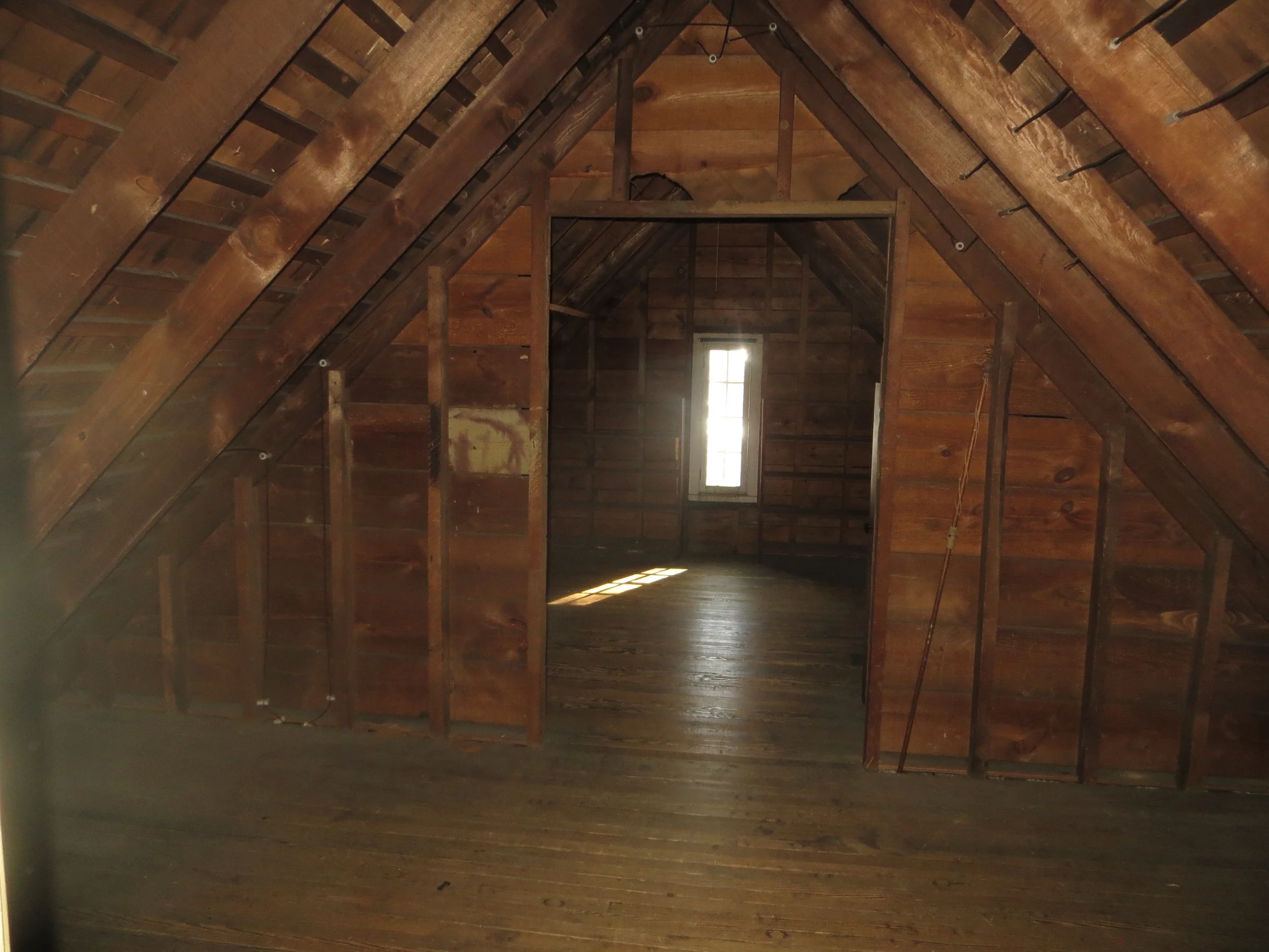 The unfinished attic before its transformation.