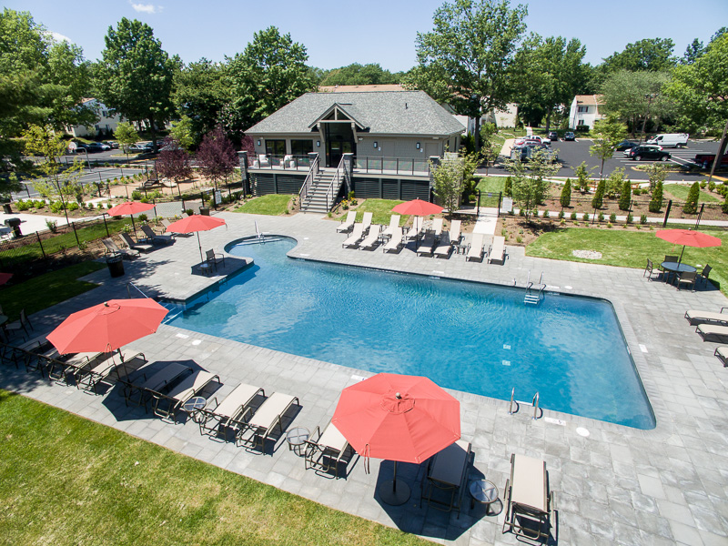 The sparkling swimming pool and inviting common areas beg for a late-summer party!