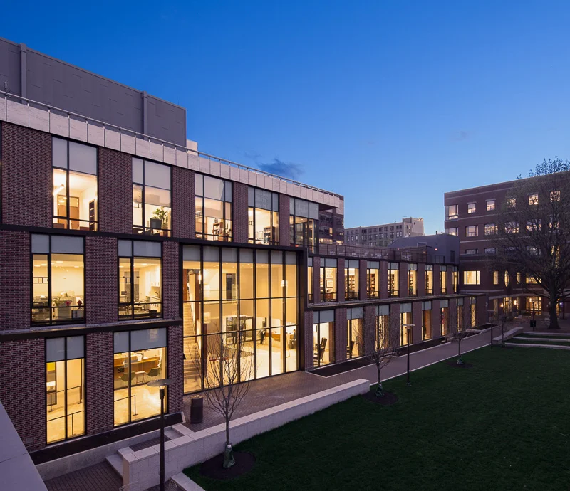 Surrounded by a busy urban area, Golkin Hall closes off one side of the Penn Law School quadrangle, providing a green space for students to relax or study.