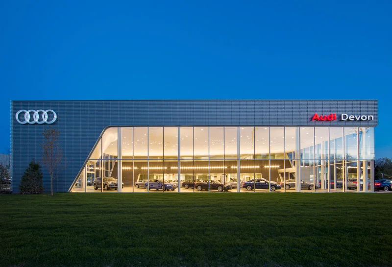 At twilight, the showroom glows like a jewel box.