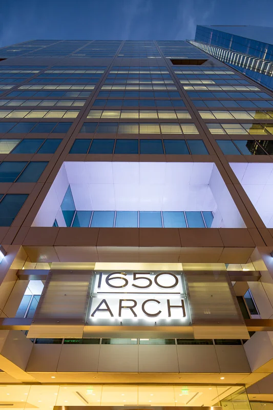 Striking angles are accented by glowing windows at dusk. 1650 Arch Street, Philadelphia.