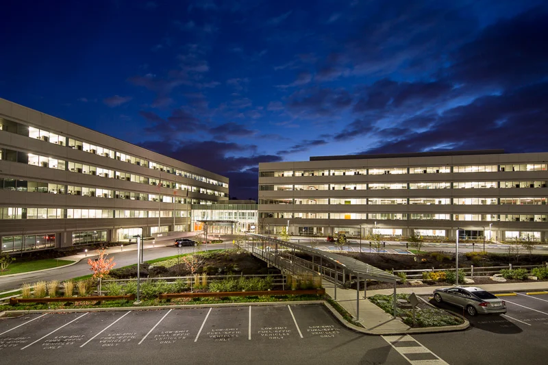 A vibrant indigo sky illuminates Endo Pharmaceuticals in Malvern, PA.