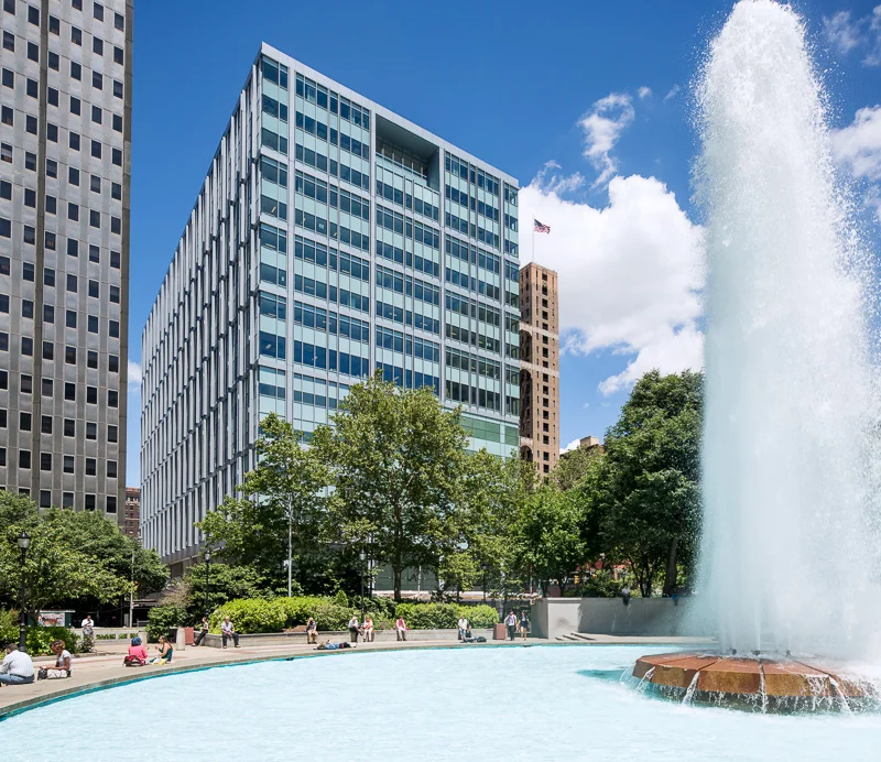 Exterior of Philadelphia’s Family Court with Love Park fountain in foreground.