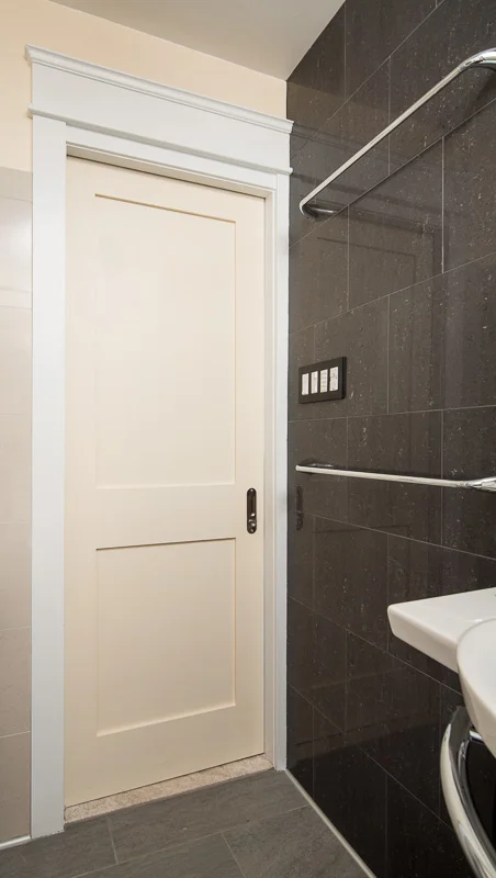 The pocket door gains valuable space in the 5 foot by 8 foot room.