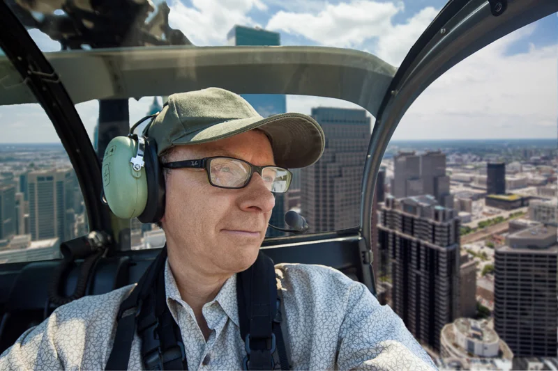 Greg flying over the city.