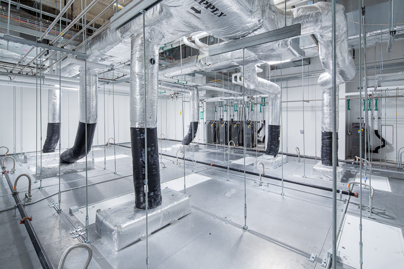 Above the ceiling sits an entire universe of mechanical systems and ducts.