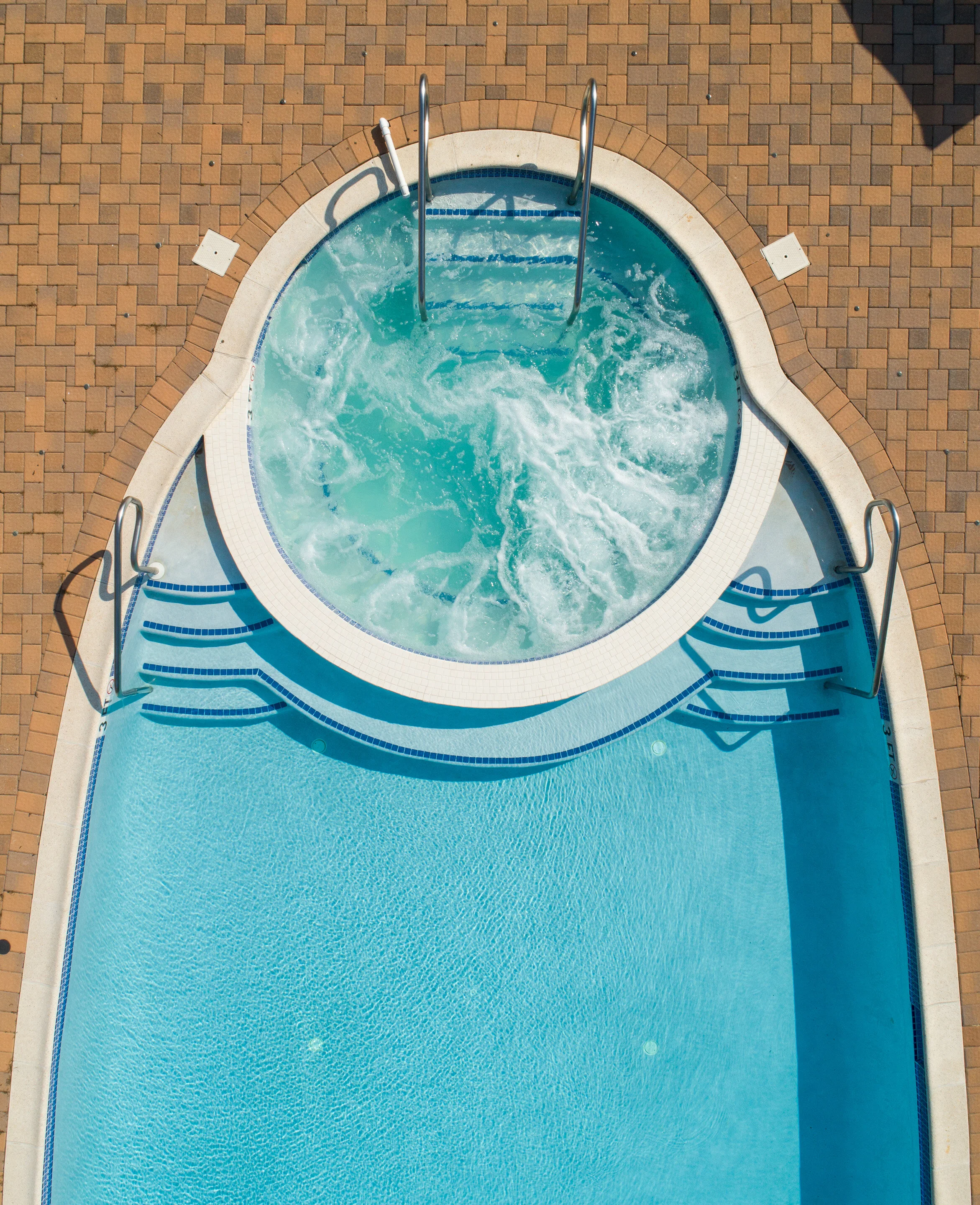 You pick – warm, swirling jets or calm, cool H2O.