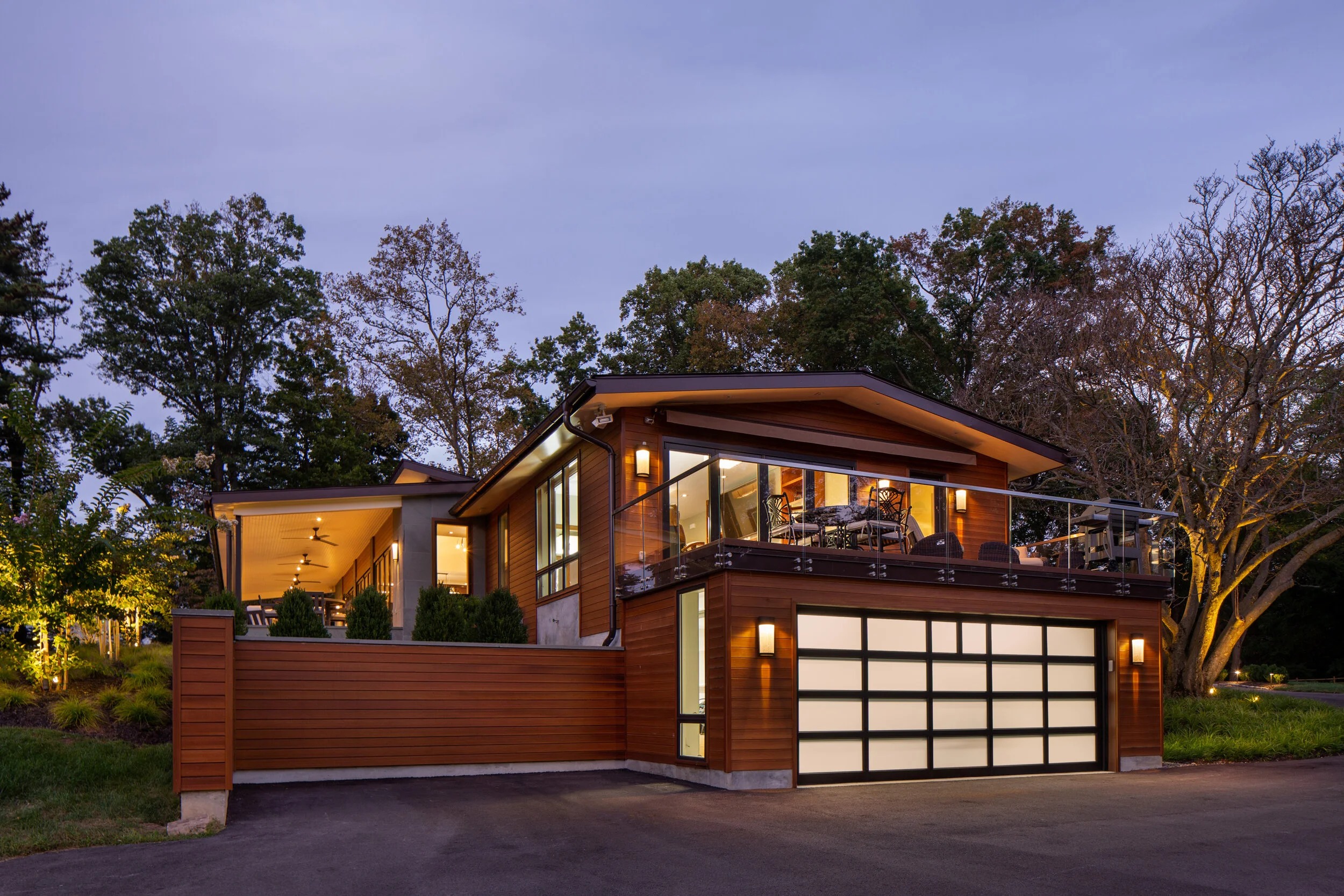 Twilight allows seeing inside this revitalized private residence in the suburbs.