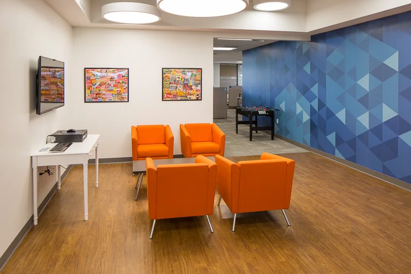 Complimentary colors orange and blue define this space