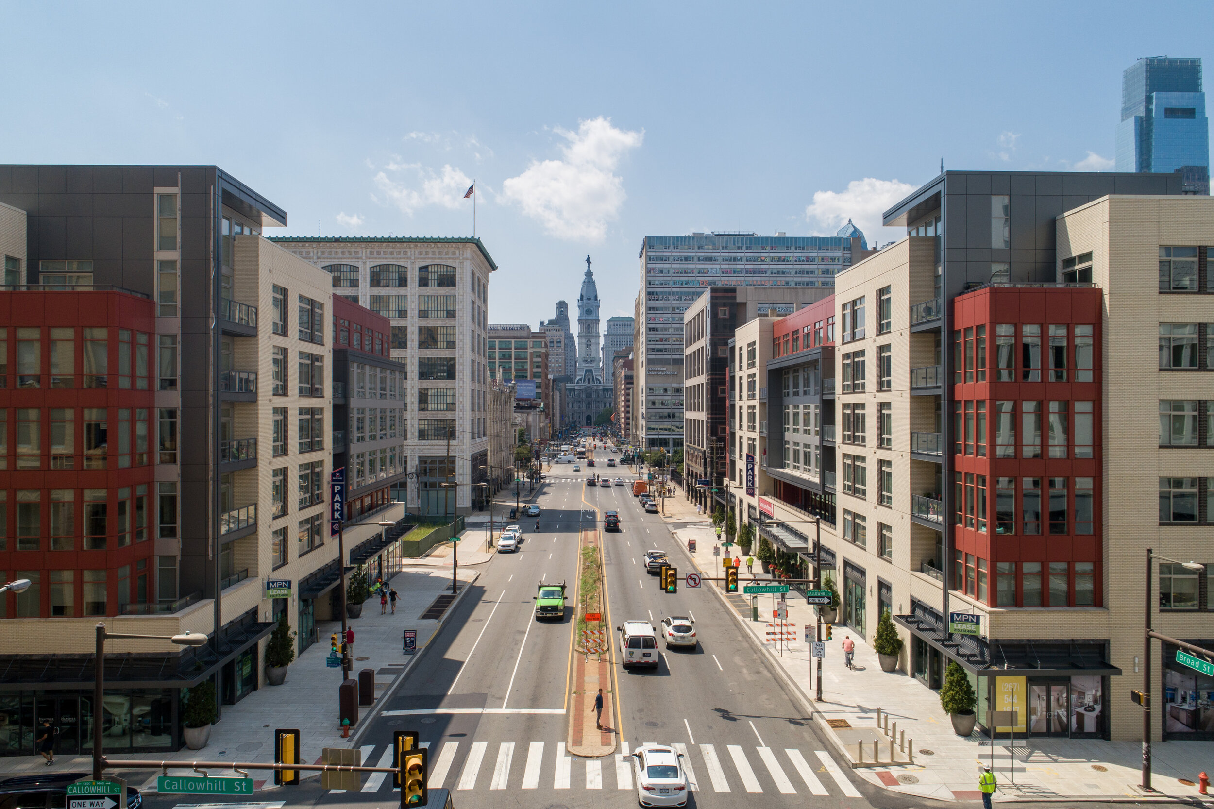 Hovering over the middle of Broad Street, Philadelphia, to capture Hanover North Broad, an apartment complex on both sides of the street.