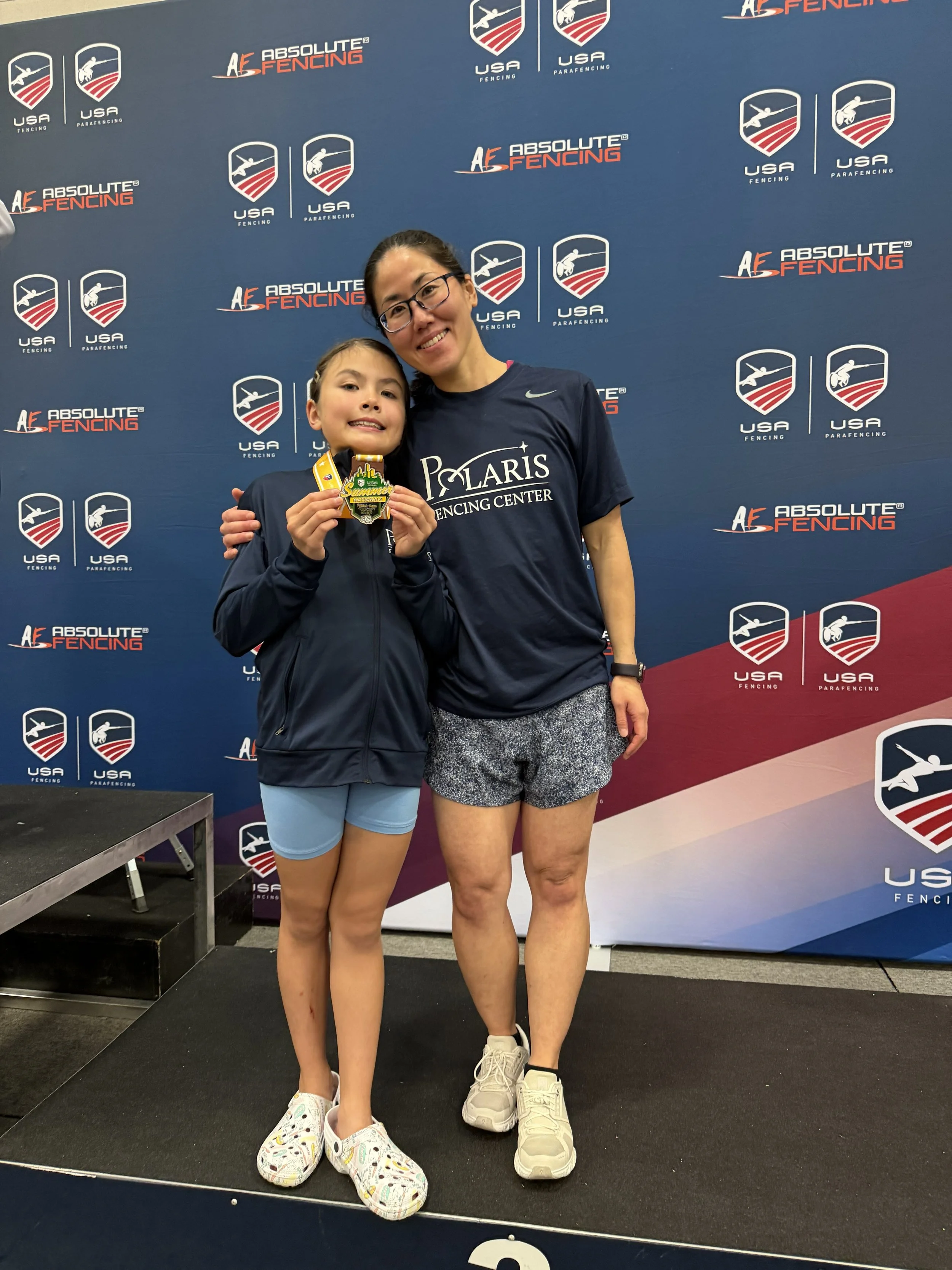 A female fencer at the finals of the Junior Olympics.