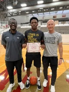 Ephraim, MHS AVID Scholar, with his basketball coaches as he heads to Austin College to study mechanical engineering and play hoops, too!