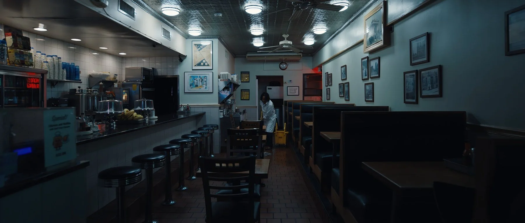 Pedigree short film still — Kai Wen Hu - Samuel cleans a diner alone at night.