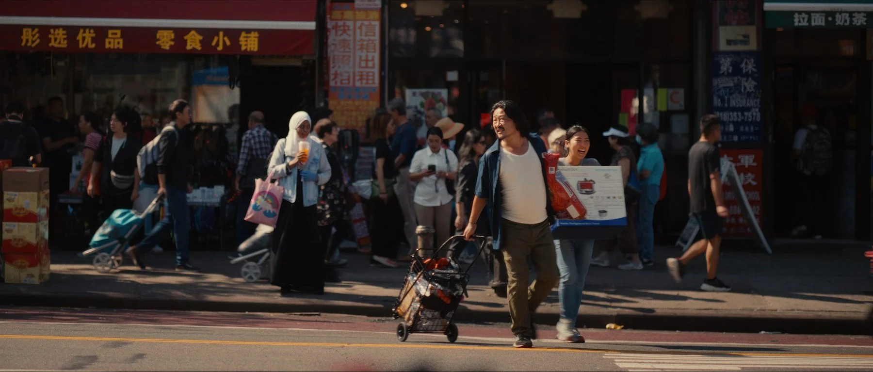 Pedigree short film still — Kai Wen Hu - Samuel and Squid, street vendors in Flushing, New York City, cross the street looking for a good place to sell their wares.