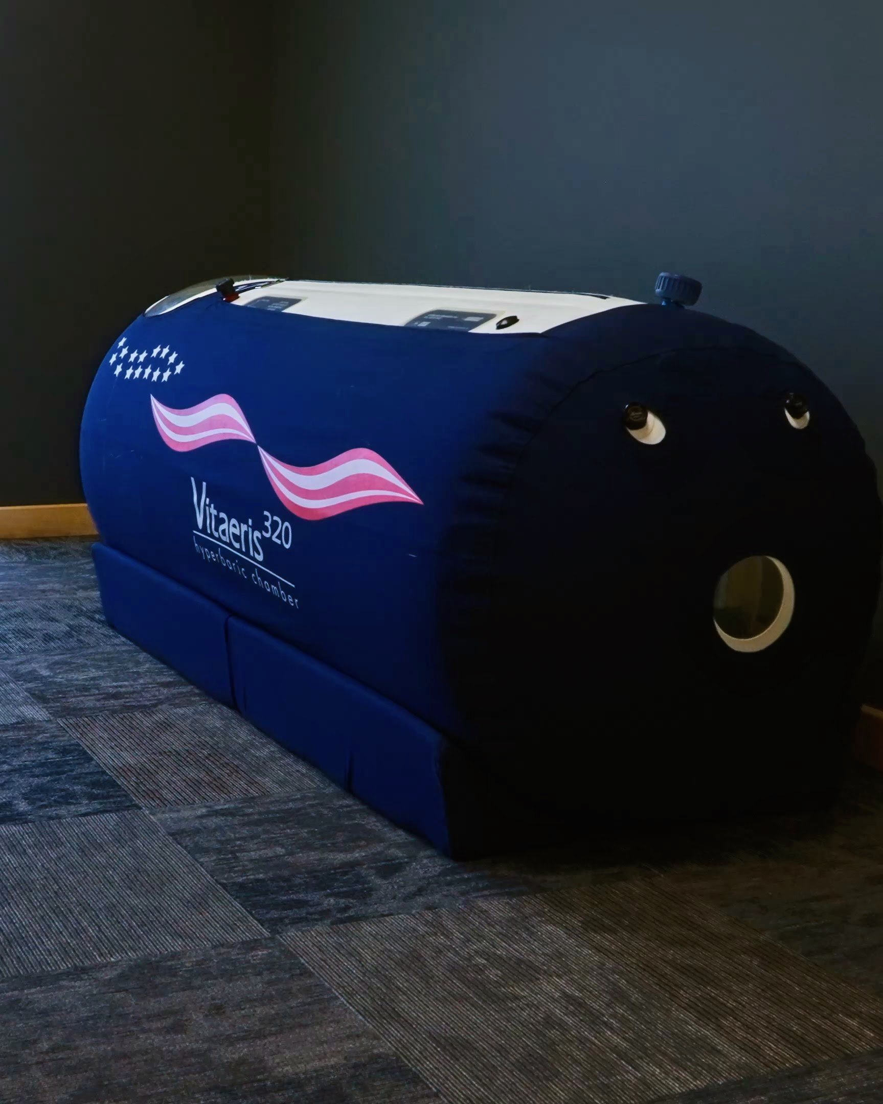 A clinical hyperbaric oxygen therapy (HBOT) chamber setup inside the VERVE Muscle Recovery lab in Logan, Utah, used for accelerating athletic recovery.