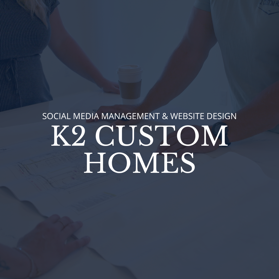 Business professionals working on custom home designs with documents and coffee on a table.