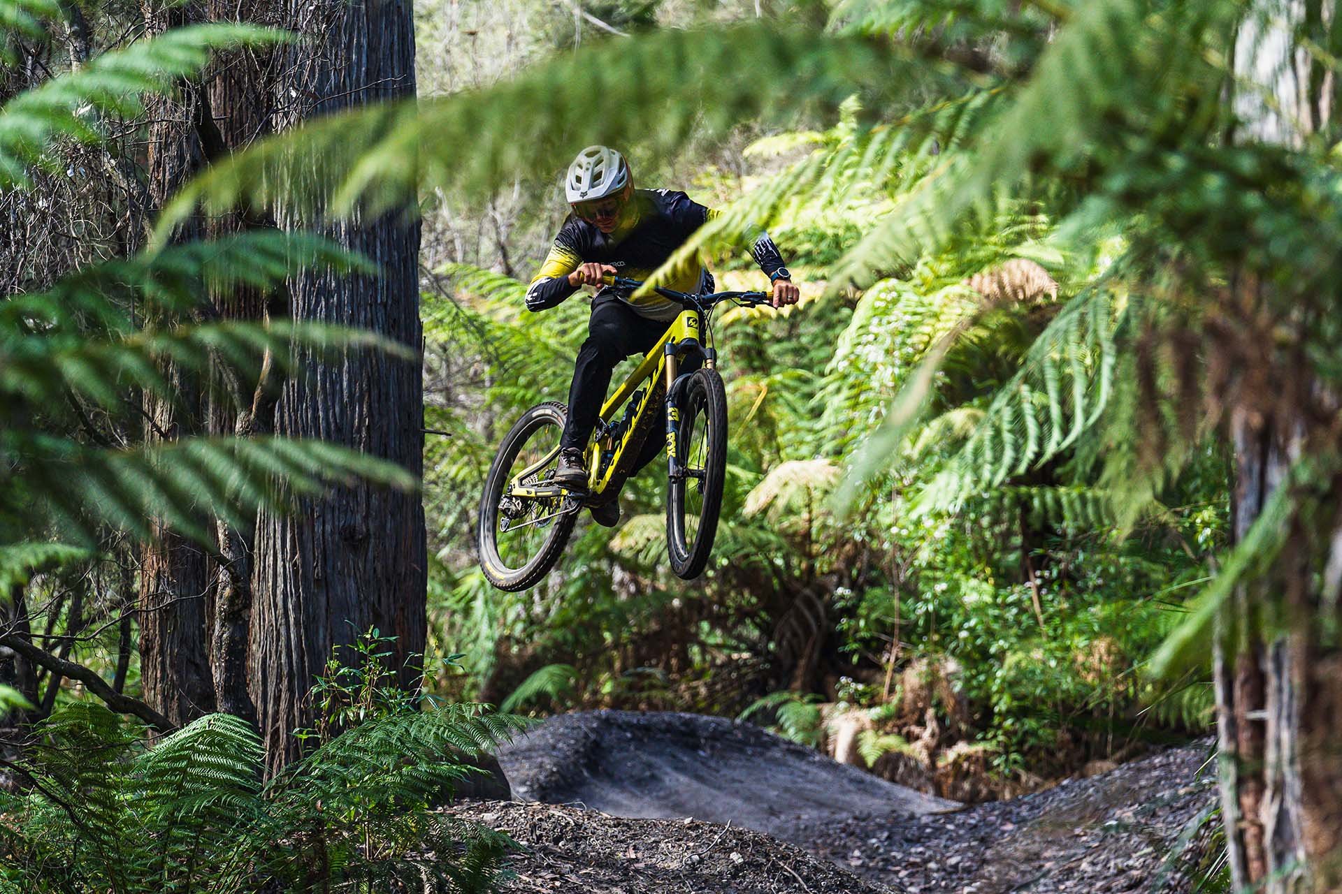 matt harrington getting air on his mountain bike in tasmania