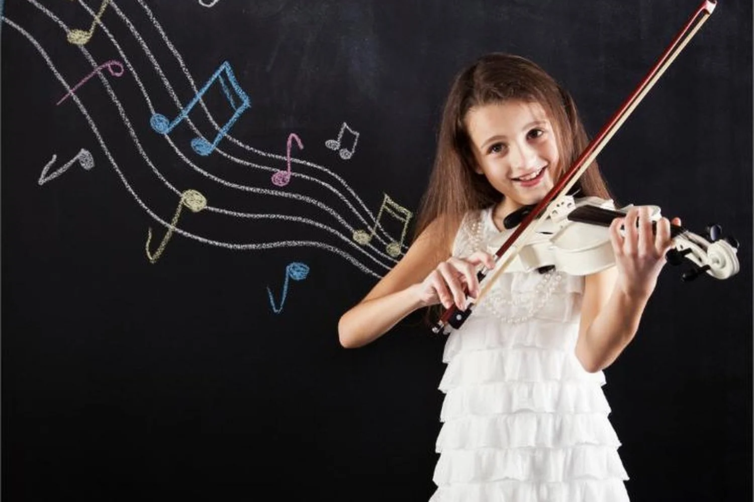 Young violin student playing during a lesson at Cave Creek Music Academy