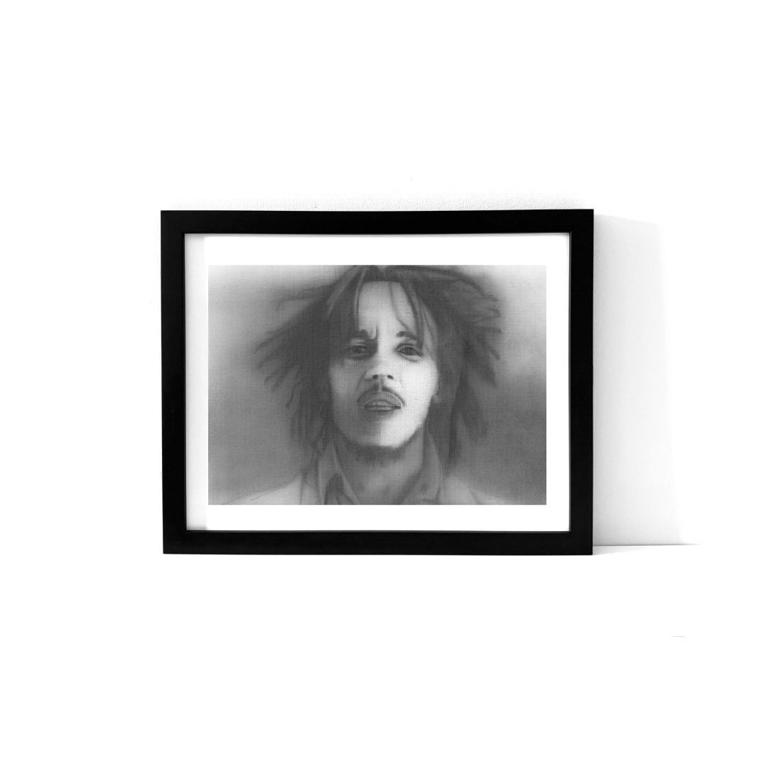 An art print featuring a portrait of Bob Marley.