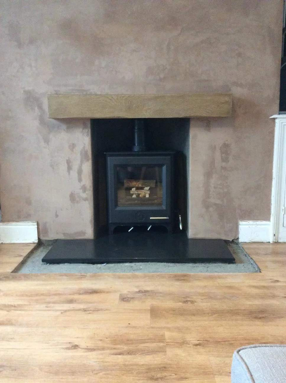 Woodwarm Logburner installed in newly enlarged fireplace opening