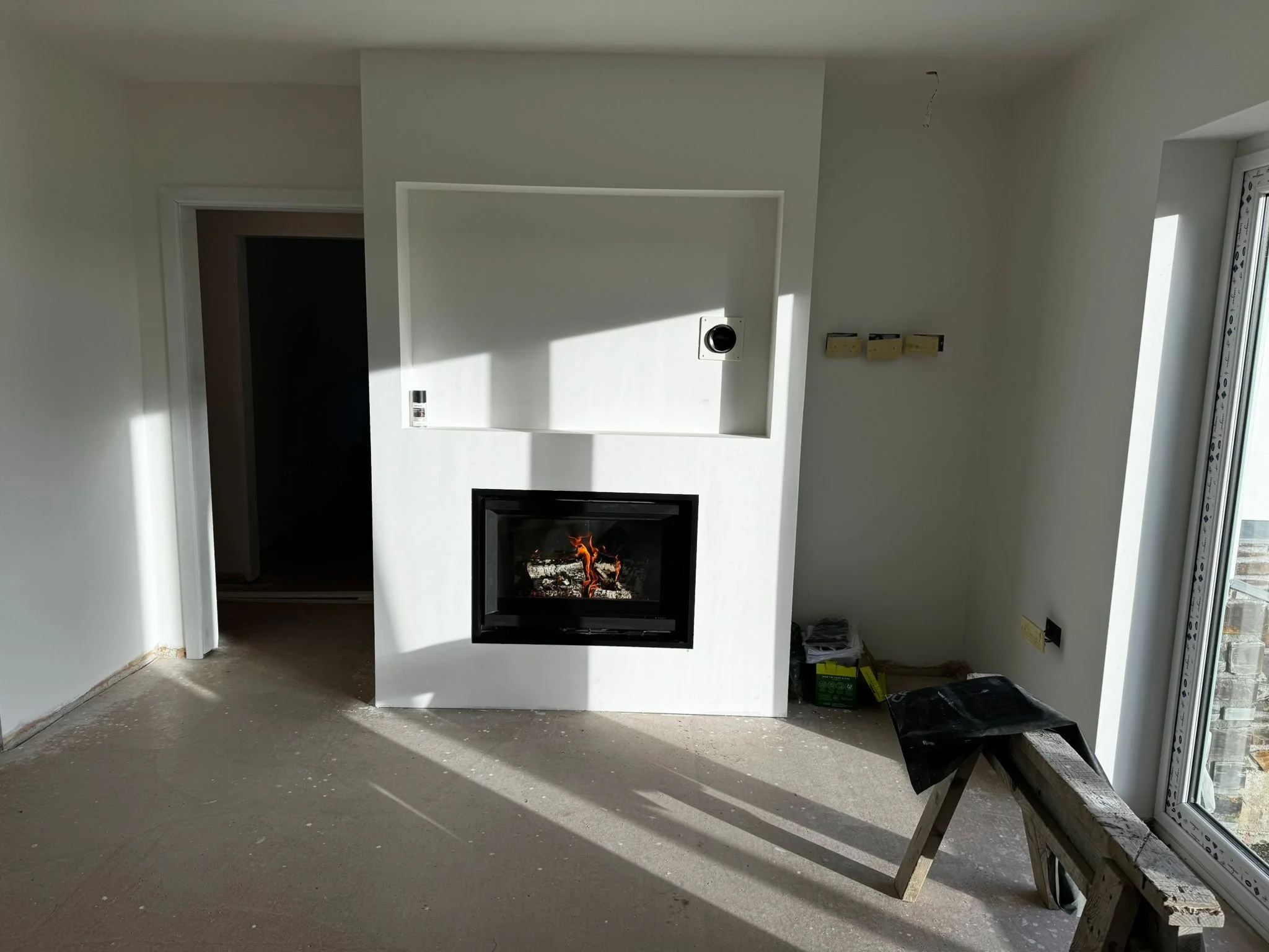 Media wall with Stuv Woodburner