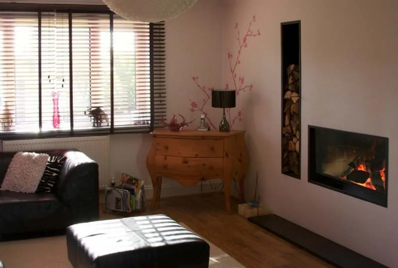 Bespoke Stuv fireplace with logstore