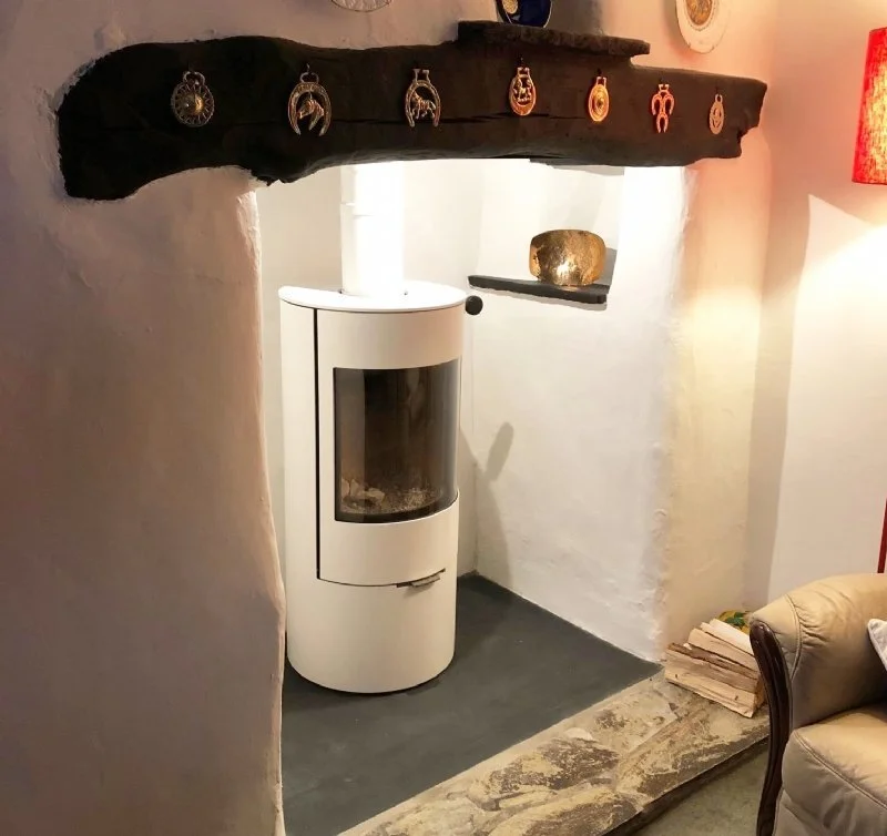 Freestanding white Rais fireplace