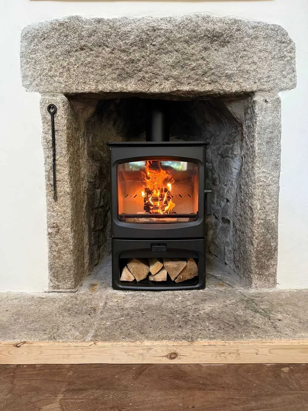 Charnwood Woodburner in a Cornish Granite Fireplace