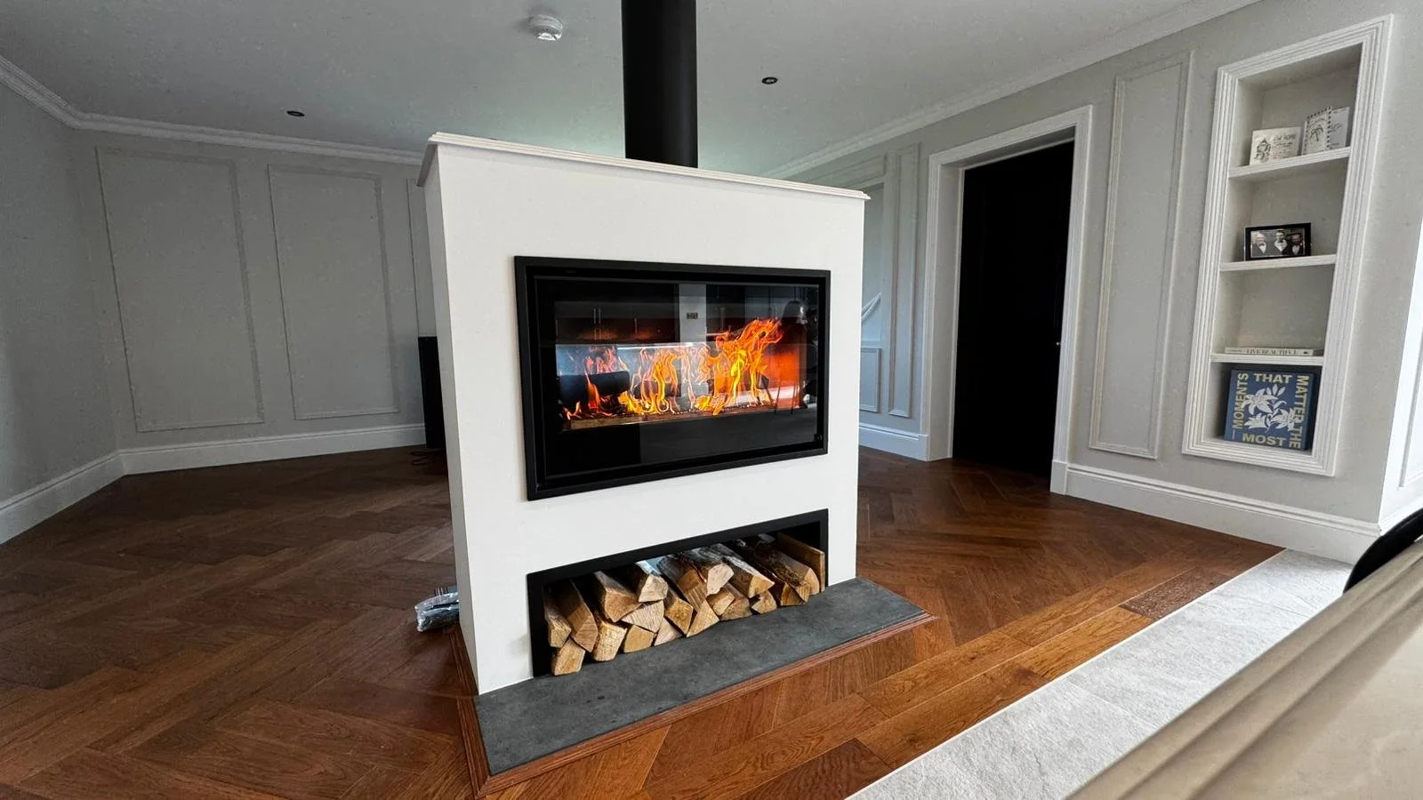 Rocal Fireplace in centre of a room in Cornwall