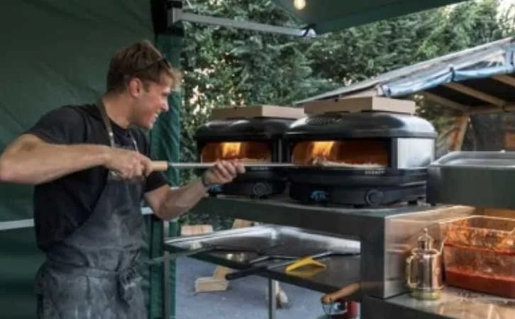 Sam cooking pizza