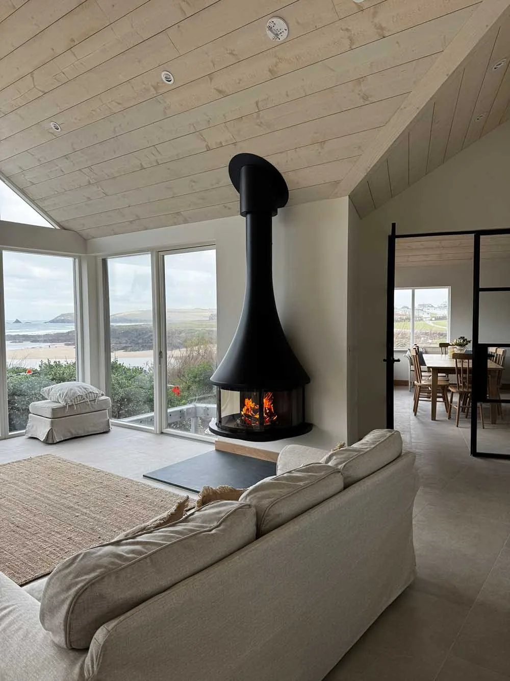 Designer fireplace Cornwall - Bordelet wall hung semi circle fire in beachfront property