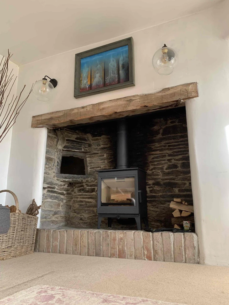 Charnwood Woodburner in a traditional Cornish Fireplace