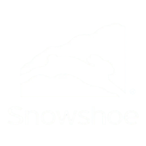 Black and white logo of a skier in mid-air with snow, above the word 'Snowshoe' in bold white letters.